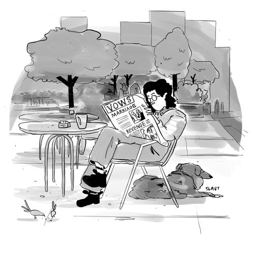 A woman reads a magazine in the park