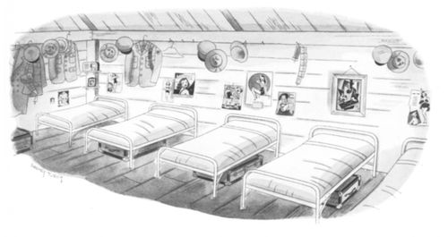 A World War II army barracks with personal effects and a Picasso painting on the wall.