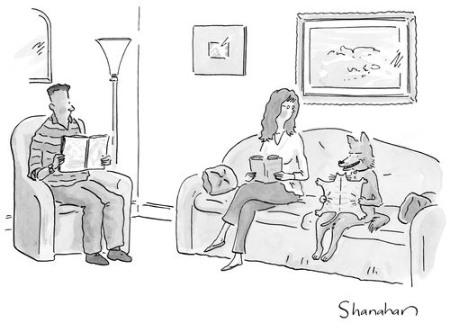 Couple sitting in living room reading books while dog reads a book with a cat shaped cover.