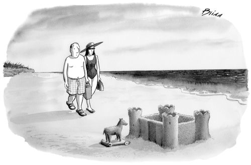 A miniature Trojan Horse sits out front a sand castle.