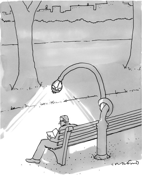 Man reading in a dark park using a streetlight as a book light