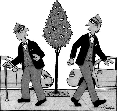 An old man and young man who are mirror images of each other pass on a street