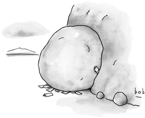 A stone in a cave has letters shoved into it.