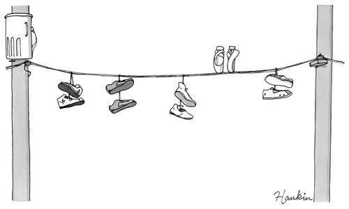 Ballet shoes balancing on a telephone wire