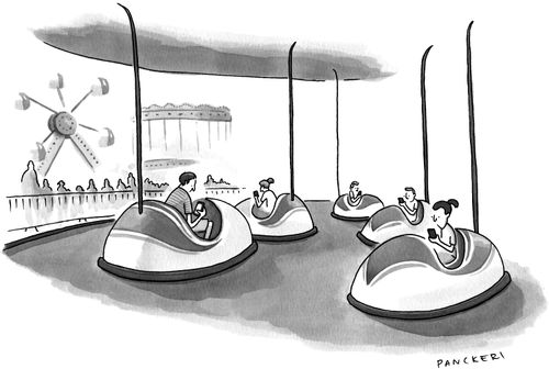 Children sitting in bumper cars playing on their cellphones.