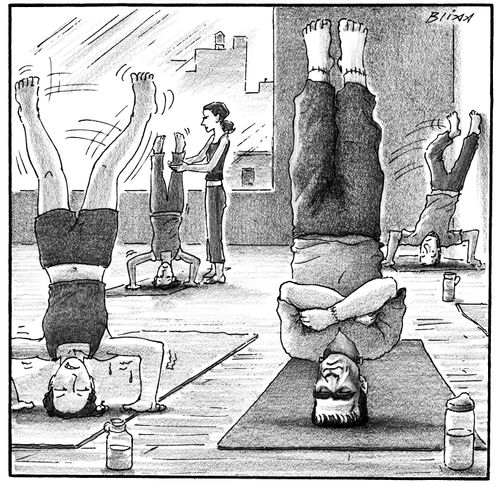 Frankenstein stands on his head at yoga class.
