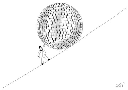 Man holds up giant disco ball on slope.