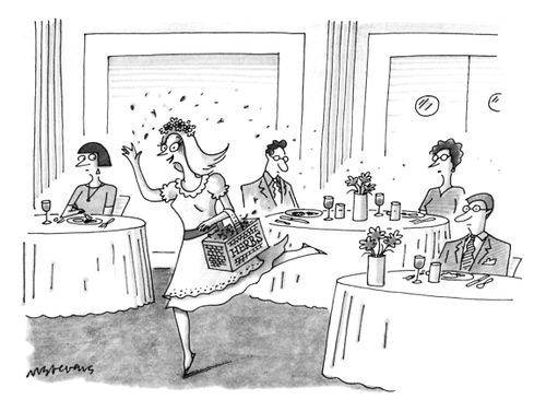 A woman sprinkles herbs in a restuarant