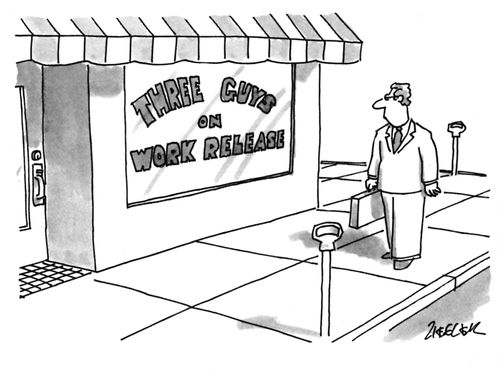 Man looking at a storefront that reads "Three Guys on Work Release".