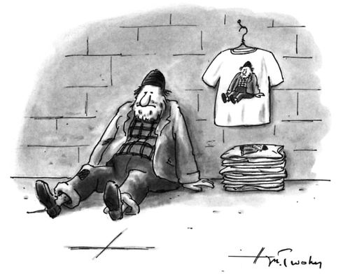 A homeless man sells t-shirts of himself.