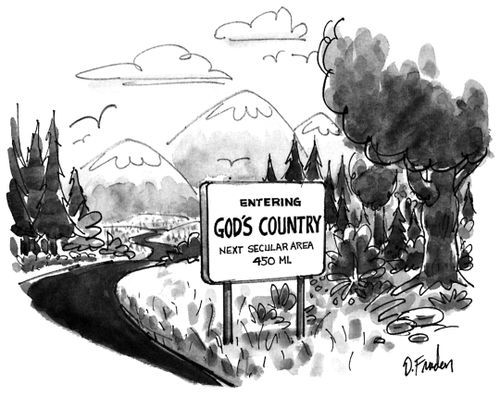 Sign saying "Entering God's Country: Next Secular Area 450 mi."