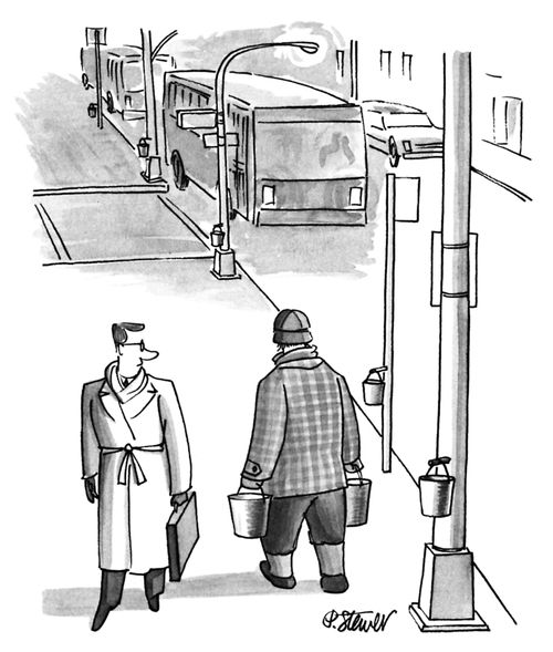 A Man Hangs Sap Buckets On The Lampposts