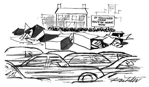 Many cars pass by a group of homeless people living in boxes beside a sign that reads: "If you lived here you'd already be home now."  