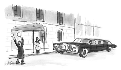 An aircraft marshal helps a limousine park