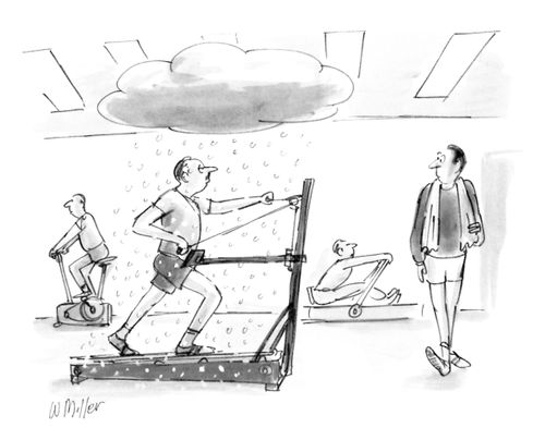 A man works out on a cross-country skiing exercise machine.