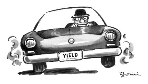 Man driving a car with a license plate that reads "Yield".
