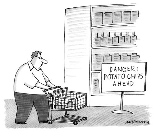 An overweight man with a shopping cart passes a sign 