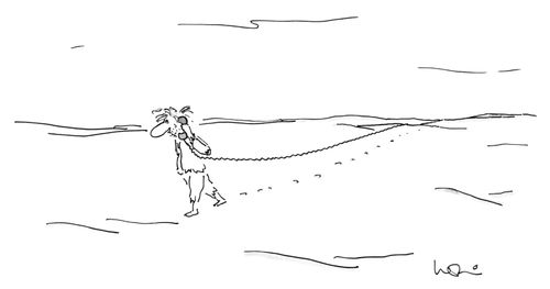 A man walks through the desert on a landline.