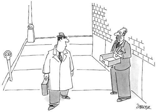 A man walks past a beggar who holds out an in-box.