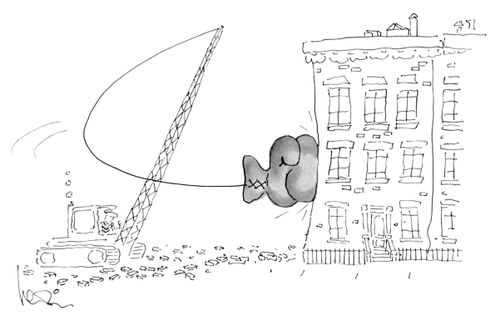 A giant boxing glove attached to a wrecker smashes into a building.