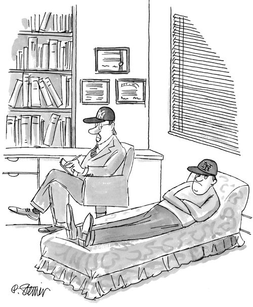 Therapist wearing a Yankees' cap talks with an upset patient wearing a Mets cap.