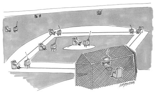 A bunch of baseball players sitting on a baseball diamond watching TV.