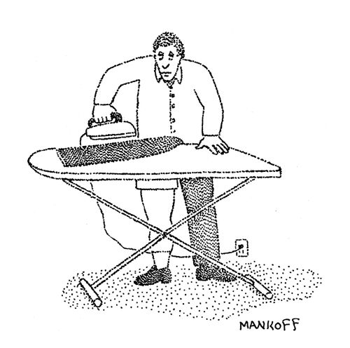 A man irons one of his pant legs.
