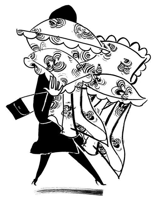 A woman carries bedsheets.