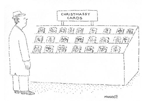 Man standing in front of a display of greeting cards labeled "Christmassy Cards".