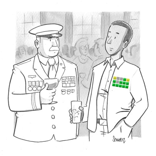 A highly decorated military officer talking to man with wearing a word game on his chest