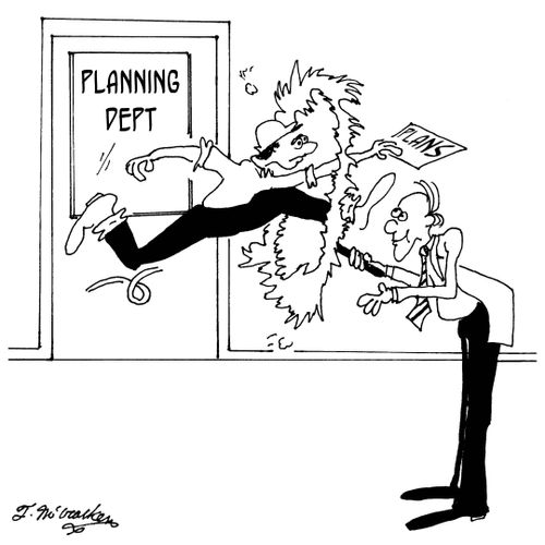 At a planning department a contractor is forced to jump through a flaming hoop held up by a building inspector.