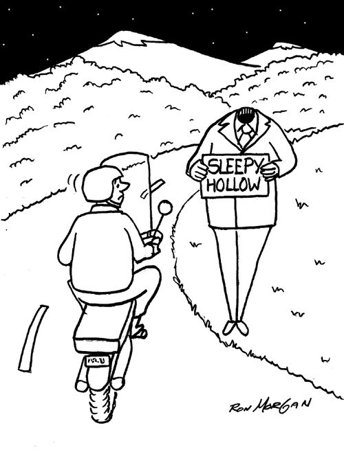 Headless hitch hiker holds sign stating his destination: Sleepy Hollow.