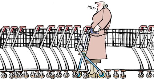 Old lady trapped between shopping trolleys.