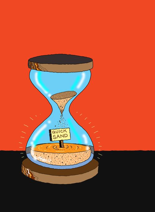 Sand timer with quicksand sign in it.