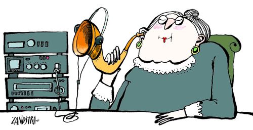 Old woman with headphones on her ear trumpet.