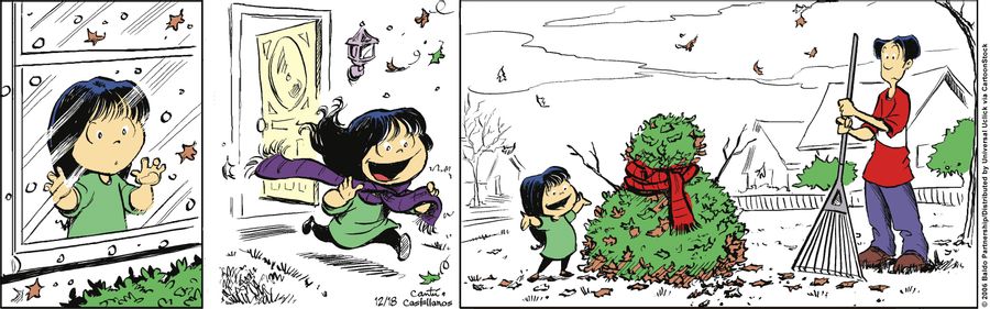 Gracie makes a snowman out of dead leaves.