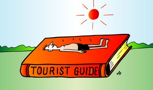 Man gets a sun tan on a tourist guide book.