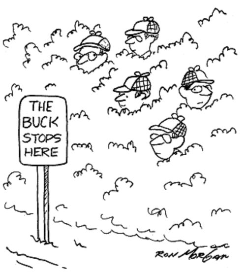 Hunters wait in bushes near sign: The Buck Stops Here.