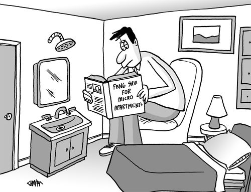 Man reading book 'Feng Shui for Micro Apartments.'