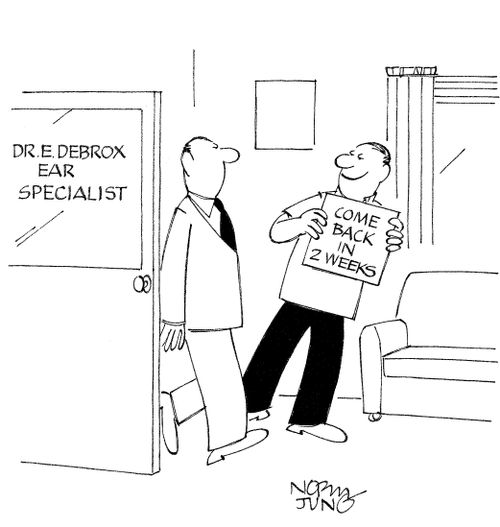 Ear specialist uses sign to communicate with hearing impaired patient.