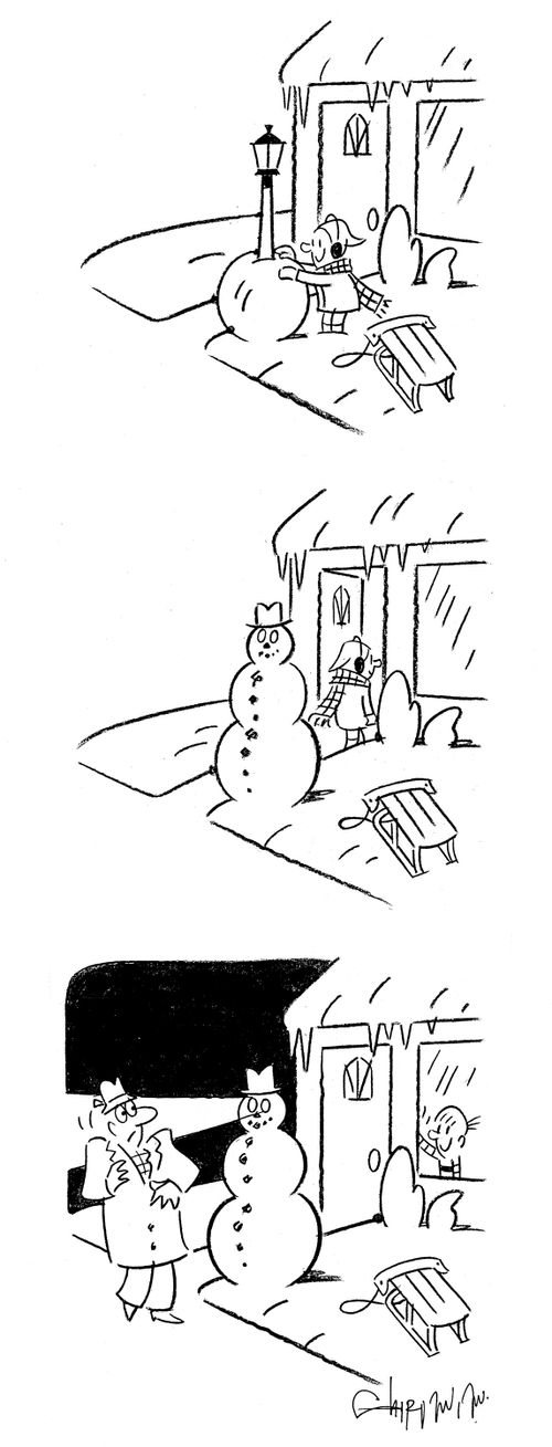 Boy makes snowman around a lamp post.