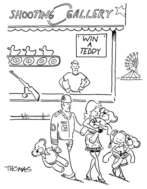 Military man wins shooting gallery game at carnival.