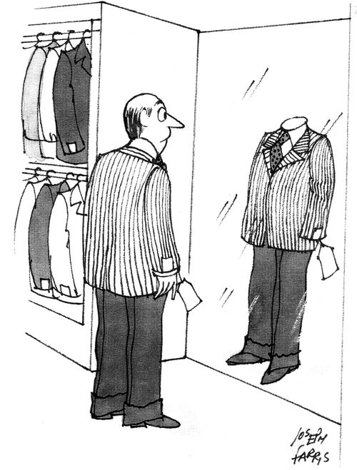 Man trying on a suit can't see himself in the mirror.