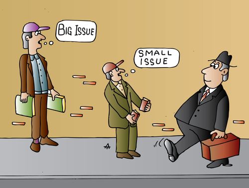 Two Street vendors, one selling the 'Big issue' the other selling 'Small issue'.