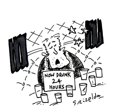 Drunk man in pub with sign reading - 'Now drunk 24 hours'.