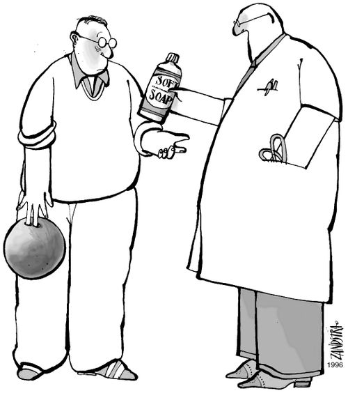 Doctor using soap to remove a bowling ball.