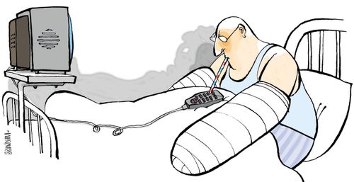 Hospital patient using his thermometer on the remote control.