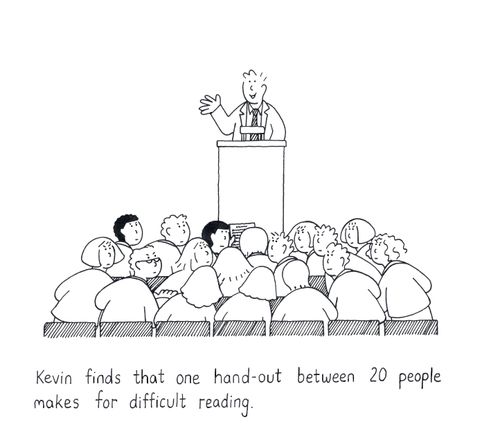 Kevin finds that one hand-out between 20 people makes for difficult reading.