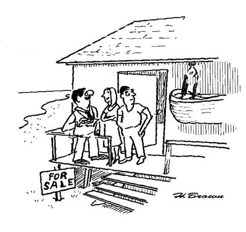 Beach front property for sale has a lifeboat.