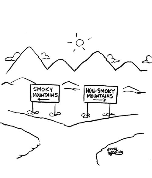 Sign that says, 'Smoky Mountains' next to sign that says 'Non-Smoky Mountains'.